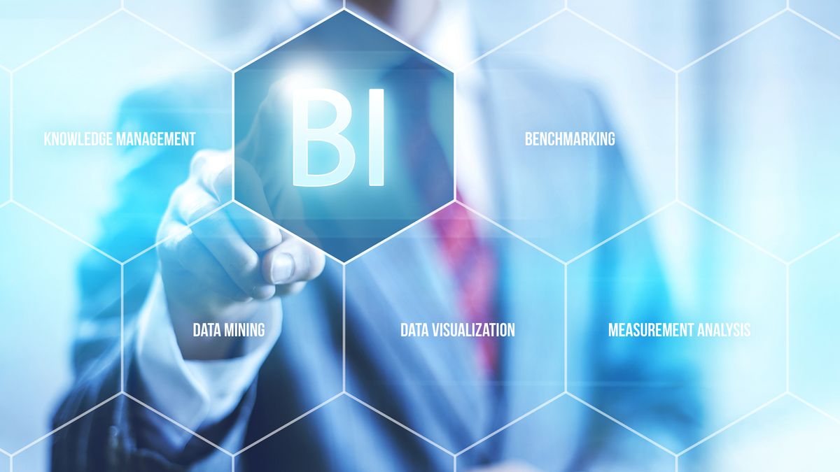 Businessman pointing to Business Intelligence icon