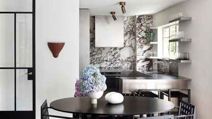 a stainless steel kitchen in a luxury apartment