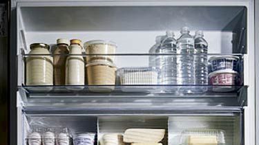 open refrigerator with food and medicine inside