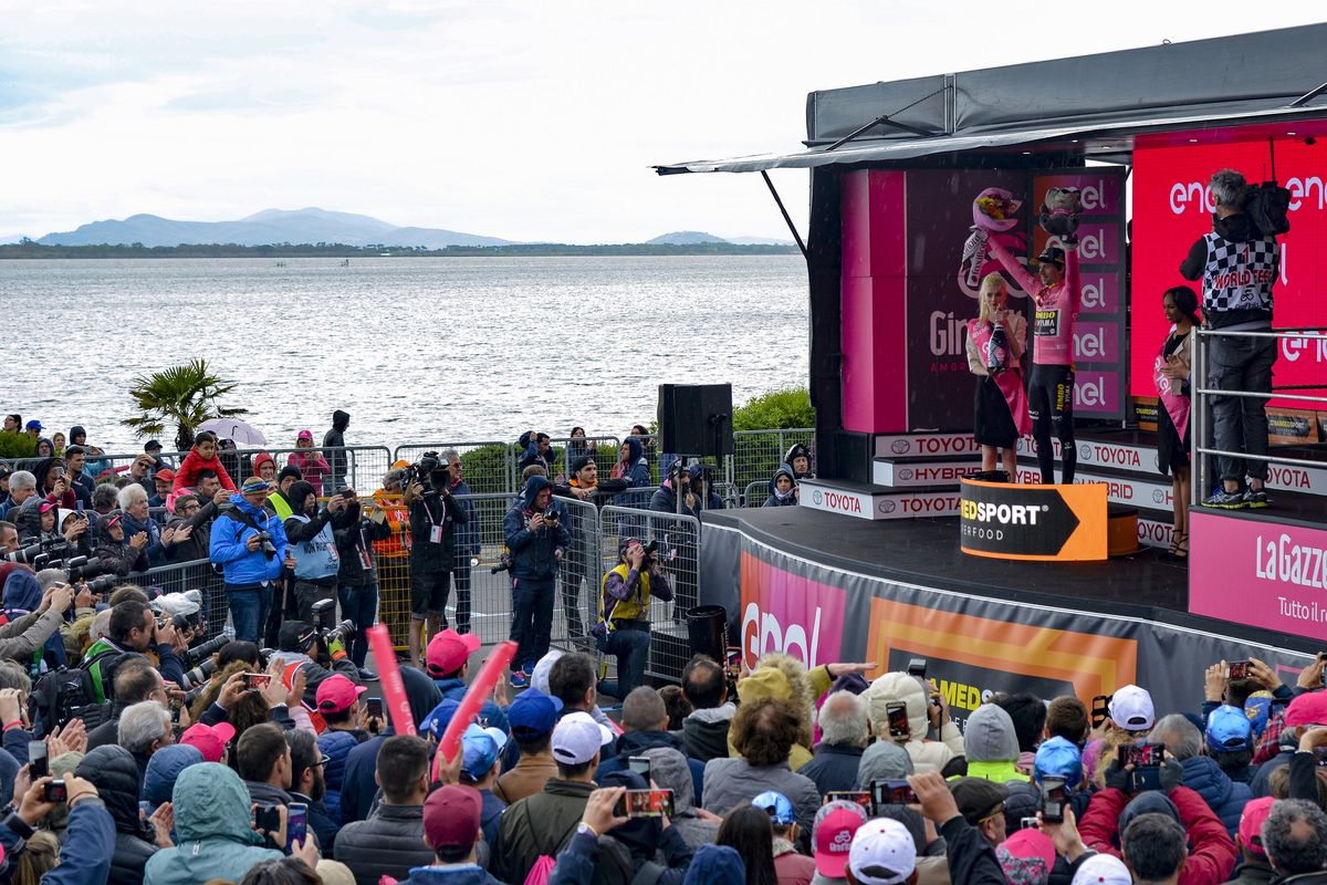 Primoz Roglic (Jumbo-Visma) on the podium by the Orbetello lagoon