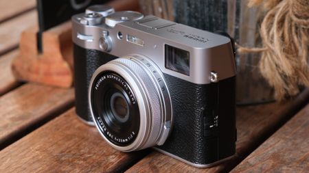 Fujifilm X100VI camera on a slatted wooden table