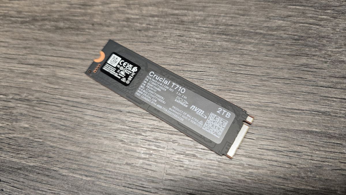 A Crucial T710 SSD on some fans ready to be installed inside a gaming PC.