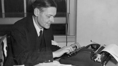 T. S. Eliot: British poet, inspecting manuscripts
