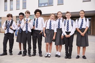 A group of kids wearing school uniform