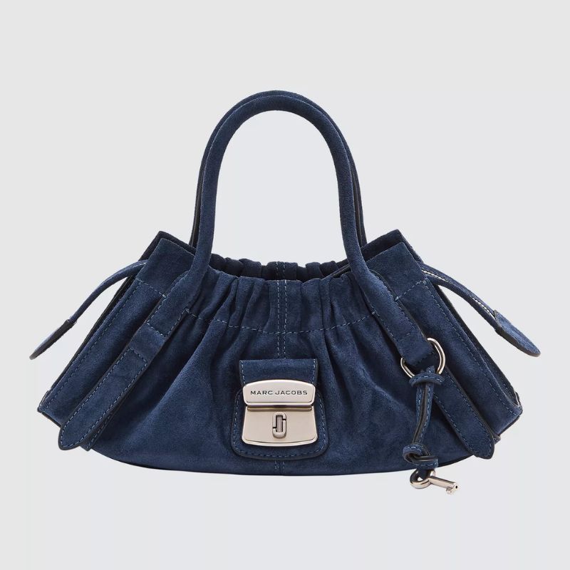 A cutout of a suede Marc Jacobs bag