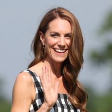 Princess Kate wears a gingham dress and has long beachy waves in her long brown hair