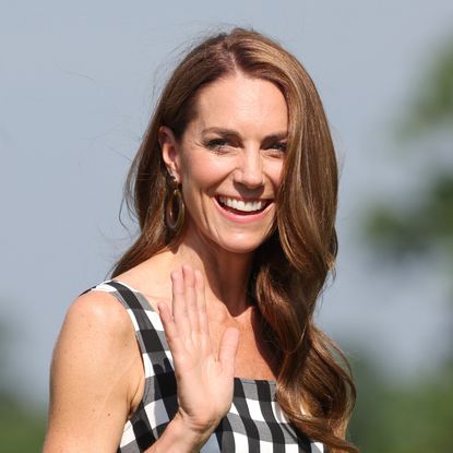 Princess Kate wears a gingham dress and has long beachy waves in her long brown hair