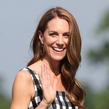 Princess Kate wears a gingham dress and has long beachy waves in her long brown hair