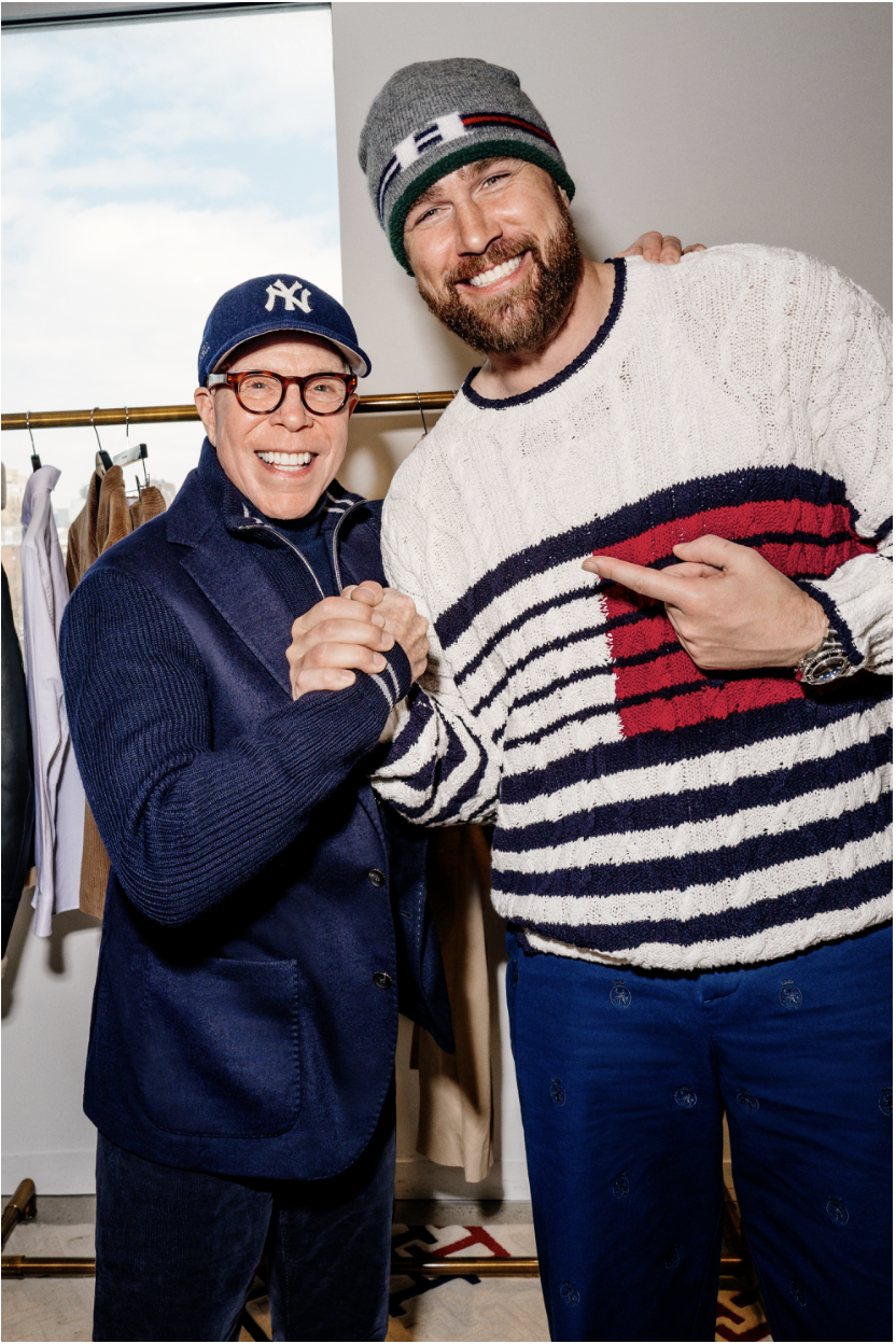 Tommy Hilfiger and Travis Kelce posing together.