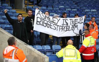 Newcastle fans protesting against owner Mike Ashley at Leicester