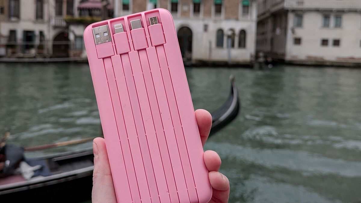 Holding a Charmast Portable Charger in Venice