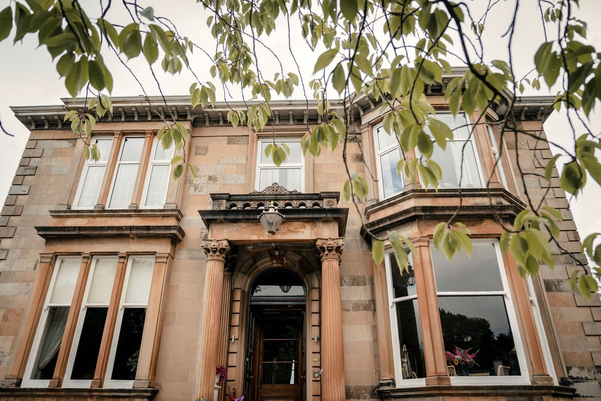 The front of the Victorian house which has been renovated shows the home has stone structured walls