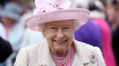 Queen Elizabeth II attends the annual garden party at the Palace of Holyroodhouse on July 4, 2017