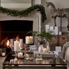 The White Company candles and reed diffusers on coffee table in festive living room