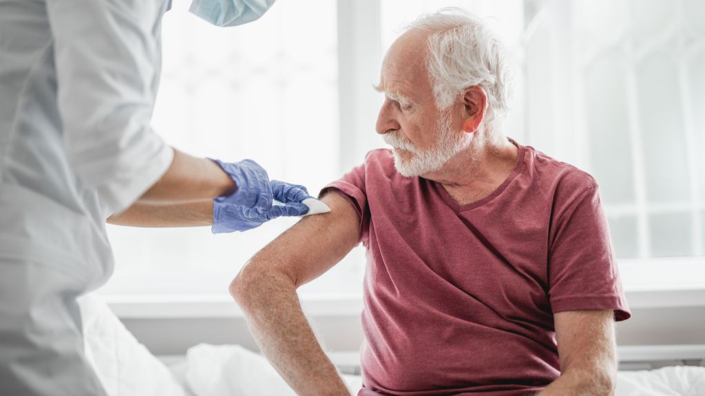 man receiving injection in his arm