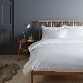 bedroom with grey contemporary scheme, wooden bed frame and white bedding by john lewis and partners