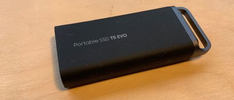 Samsung T5 EVO SSD on a wooden desk