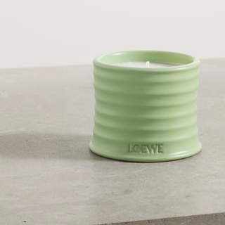 scented candle in ribbed green jar