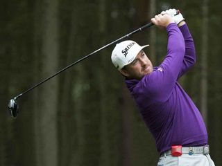 Graeme McDowell tests Game Golf Live during a practice round at the British Masters