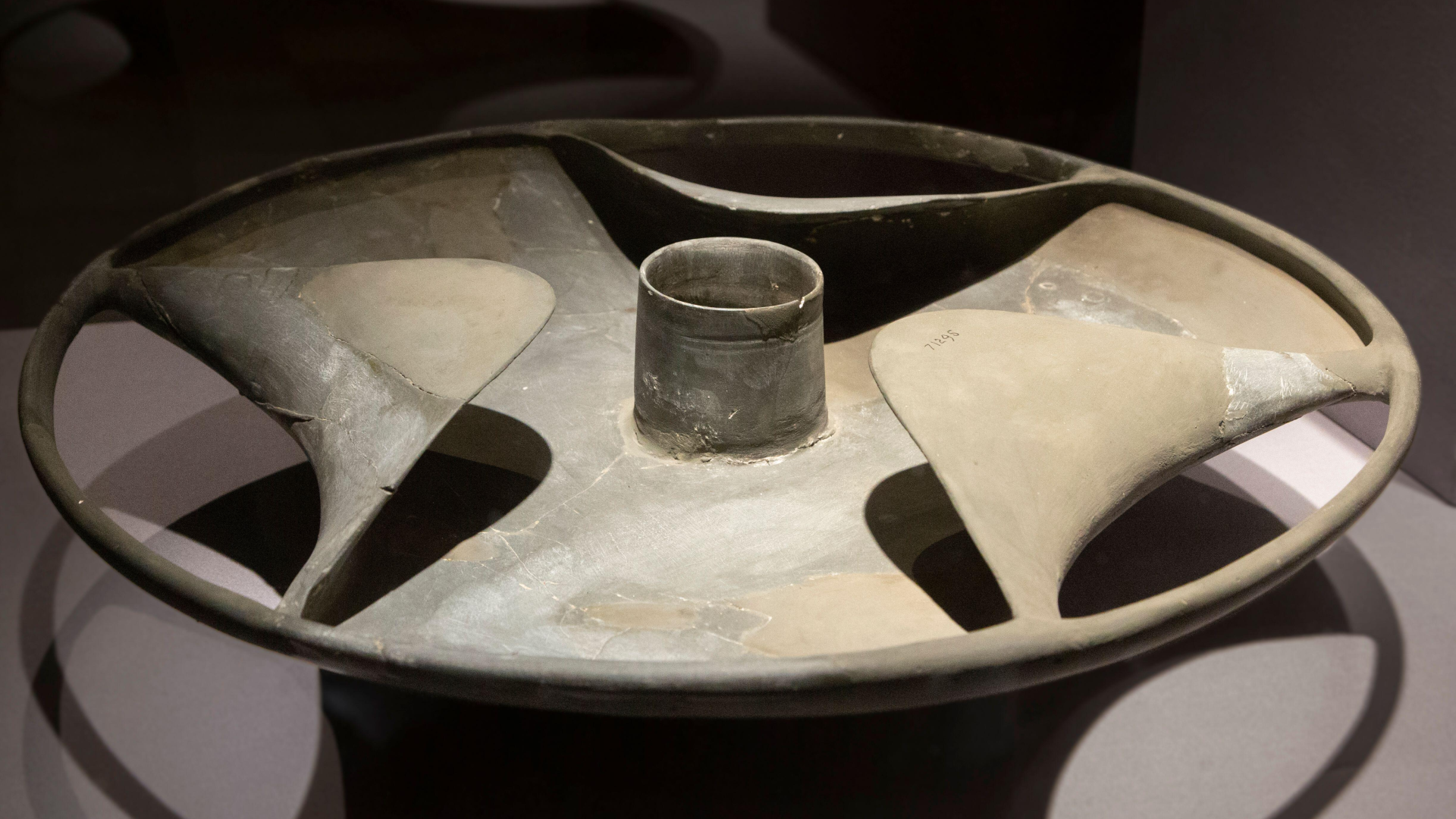A stone disk shaped like a hubcap