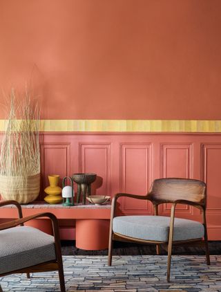 Seating area with coral orange walls