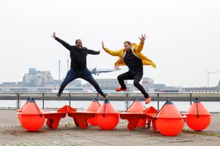 mccloy muchemwa the buoys are back in town - Two people jumping on red Buoys