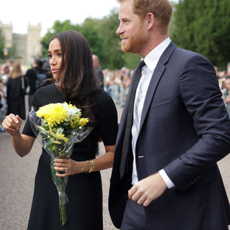 Meghan Duchess of Sussex and Prince Harry, Duke of Sussex speak with well-wishers at Windsor Castle on September 10, 2022 in Windsor, England. Crowds have gathered and tributes left at the gates of Windsor Castle to Queen Elizabeth II, who died at Balmoral Castle on 8 September, 2022.