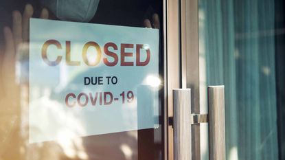 A "Closed Due to COVID-19" sign