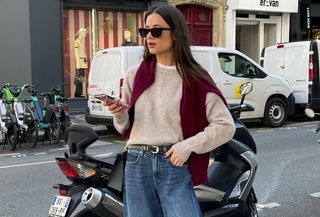 Woman in sweater and jeans.