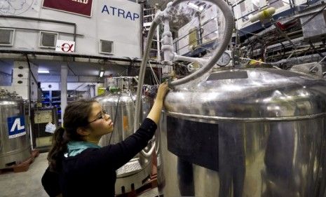 A PhD student transfers liquid helium into the superconducting magnetic trap that was used to capture antimatter for limited amounts of time