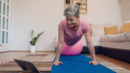 Grey haired woman exercising