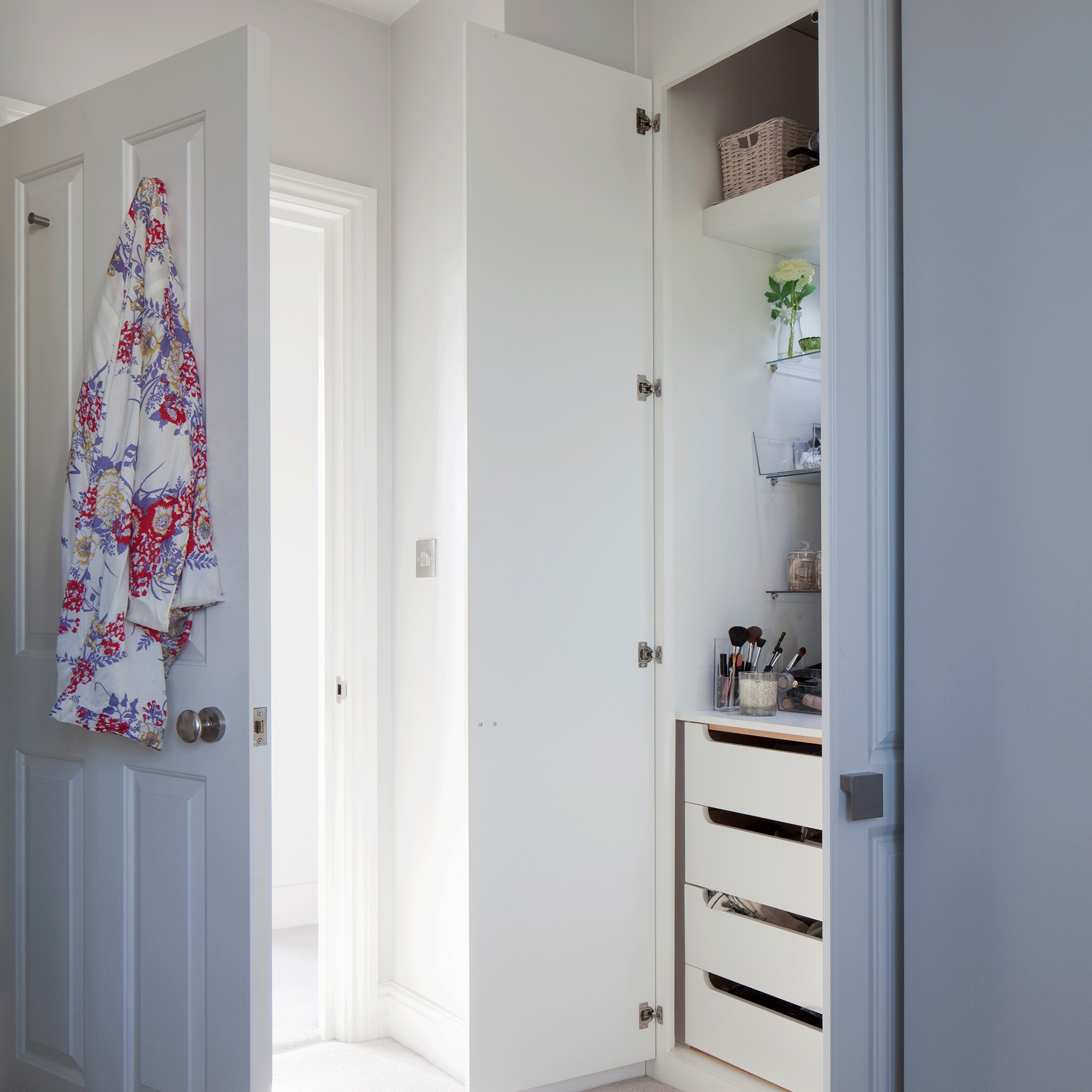White door with white walls and hook