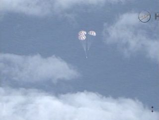 Orion Spacecraft with Main Chutes Deployed