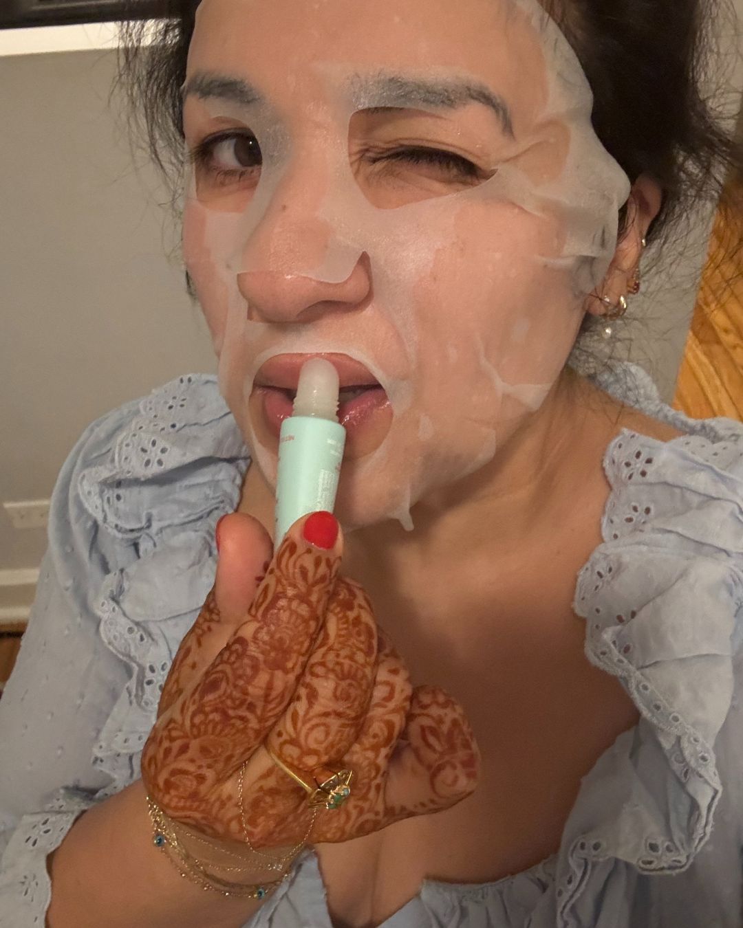 Kirin Bhatty applying skincare products.