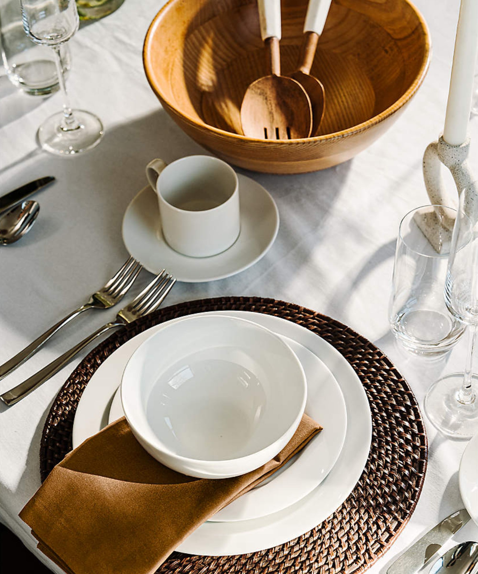 White tablescape with brown placemats and napkins