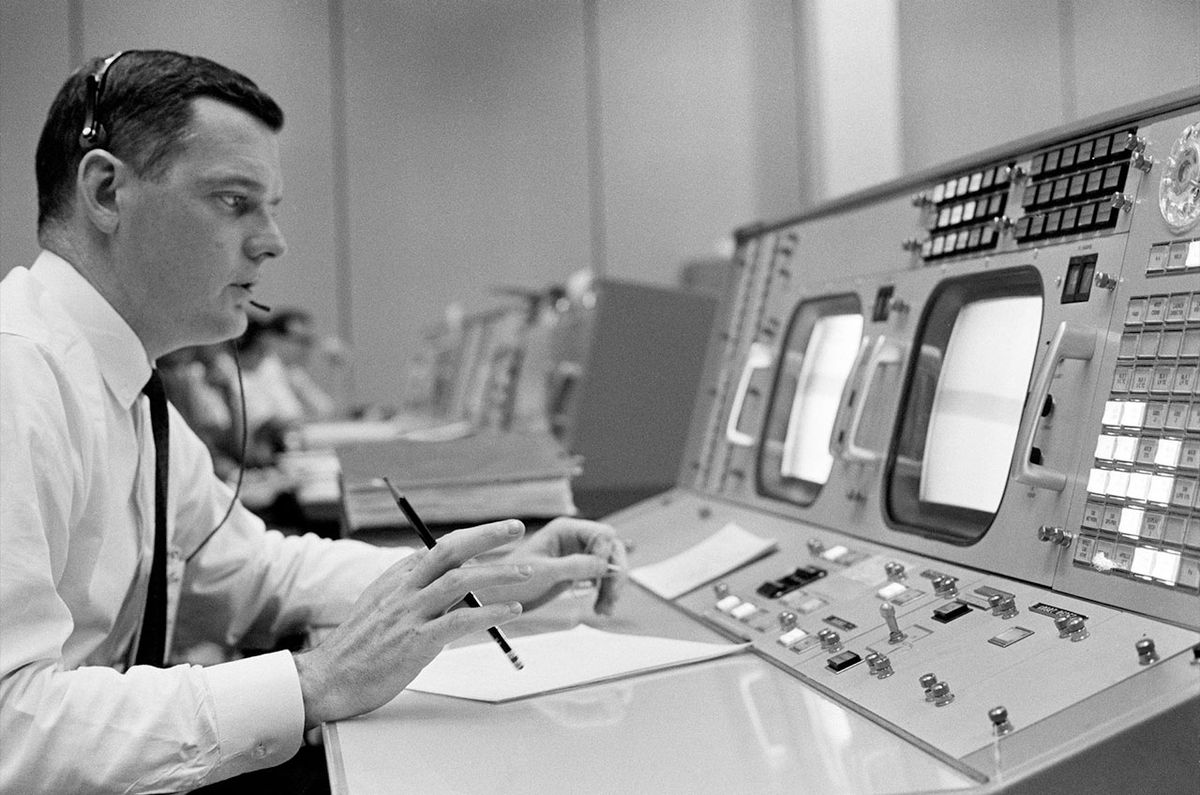 Flight director Glynn Lunney at his console in the Mission Control Center during an Apollo simulation exercise in 1965. 