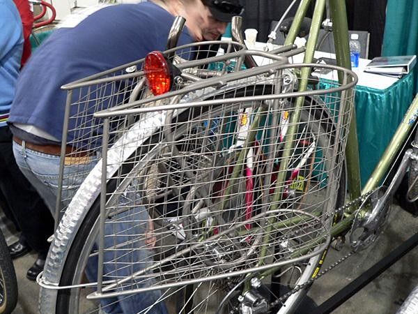 For the ultra-chic paperboy Bruce Gordon offers this set of titanium baskets, requiring upwards of 500 individual welds per set. And yes, the whole thing is titanium: he used titanium welding rod to make the mesh sides.