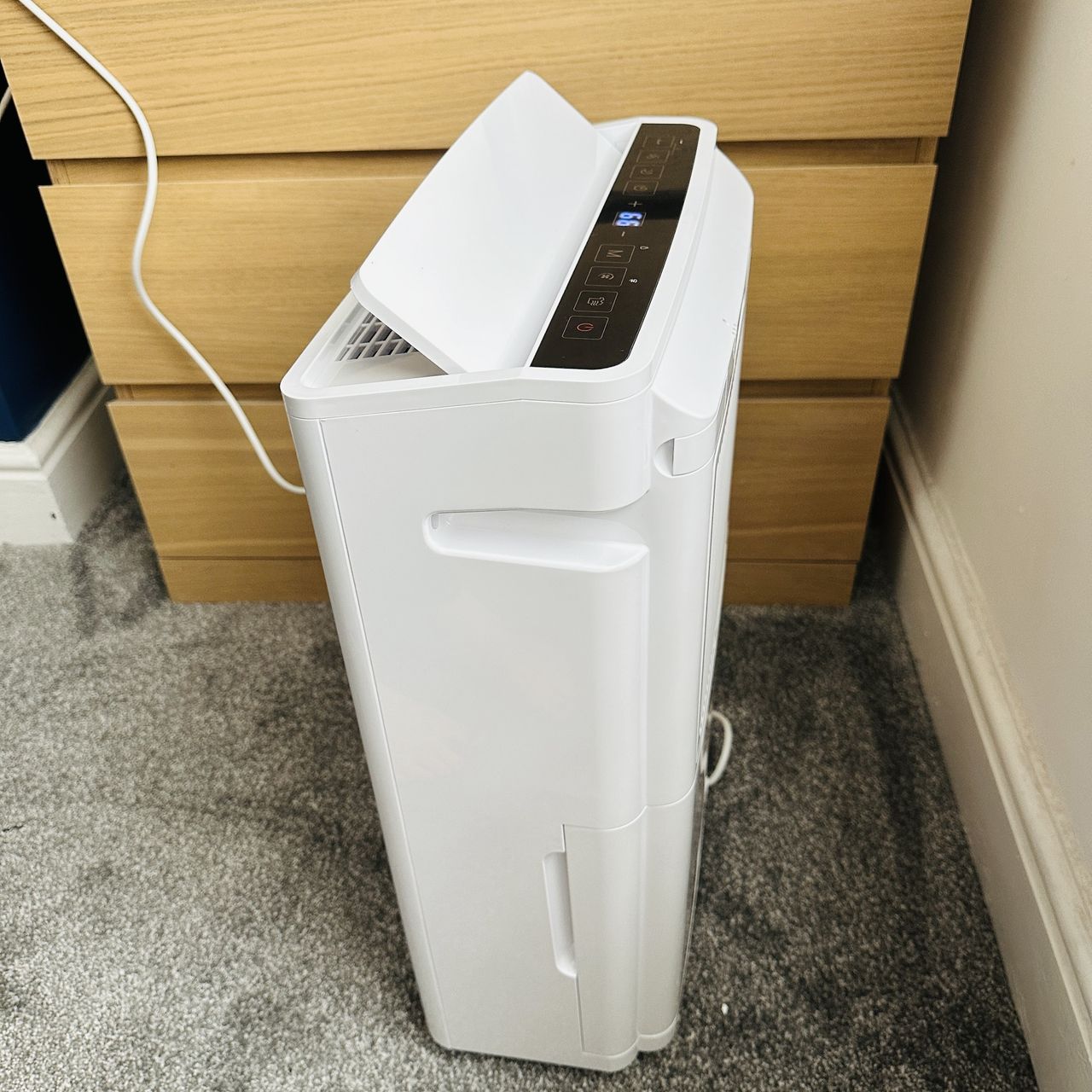 Pro Breeze 20L Premium Dehumidifier with Special Laundry Mode being tested in a carpeted room