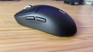 Logitech G Pro X Superlight 2 mouse on a wooden table