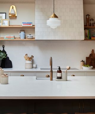 kitchen with white tiles and kitchen counter