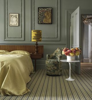 green bedroom with green striped carpet