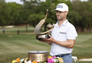 Moore poses with the Valspar Championship trophy