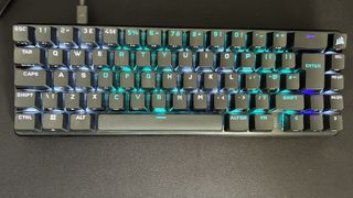Corsair K65 Pro Mini RGB keyboard on a matte black background