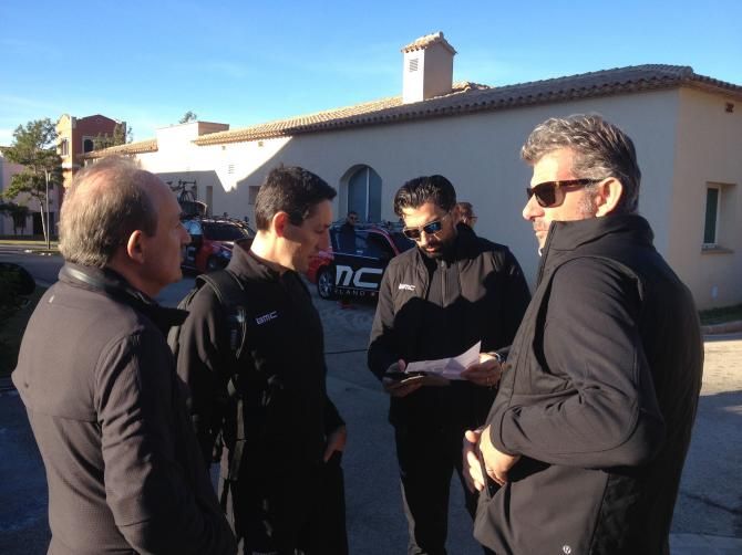 The team directors review the day's plan