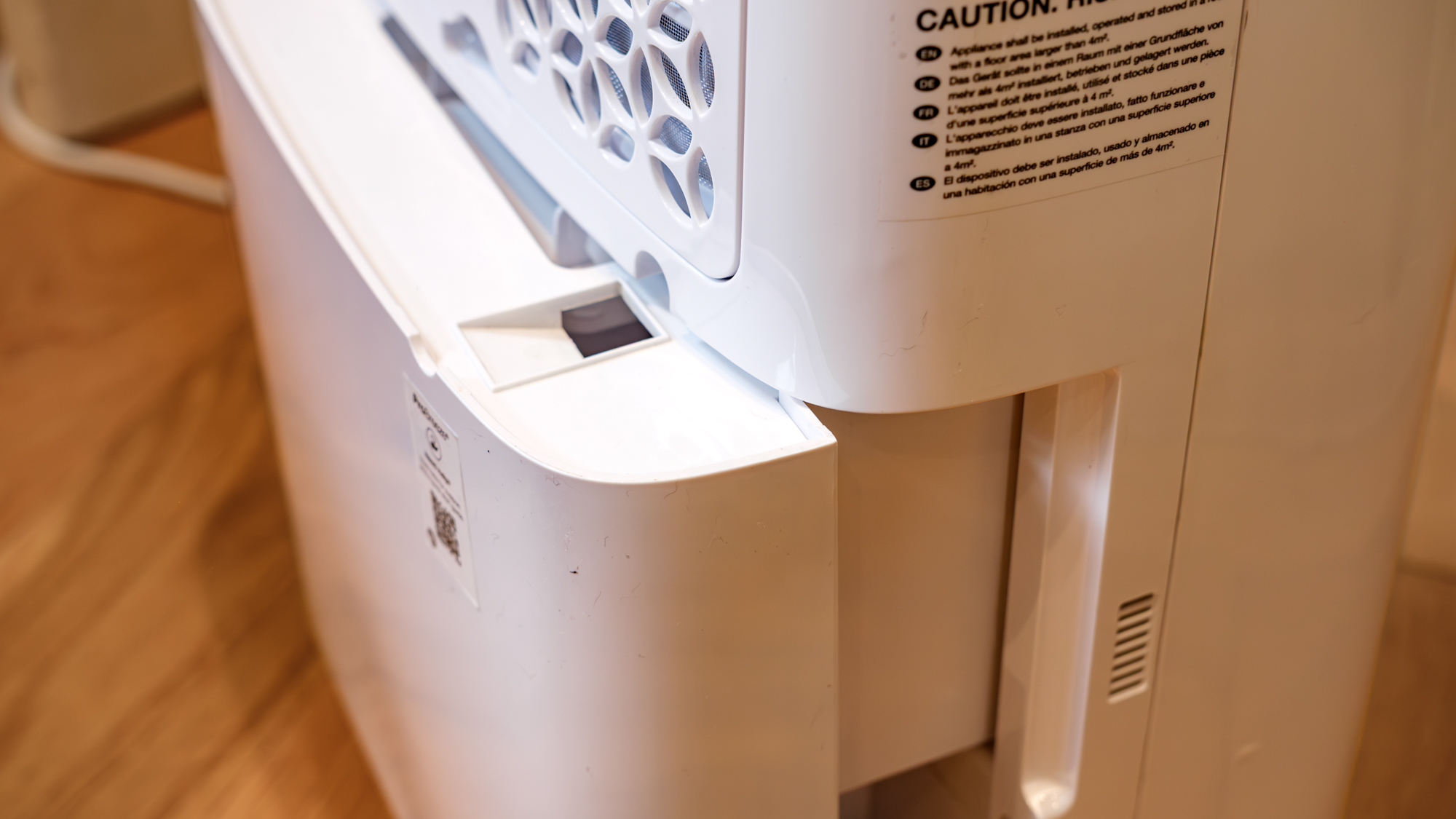 The Pro Breeze 50-pint Dehumidifier on a hard wood floor in a home environment