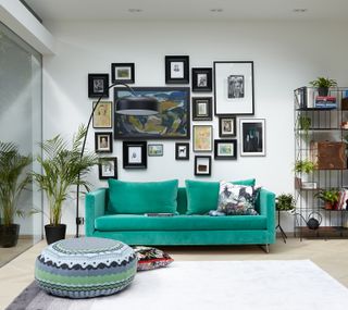 green sofa, gallery wall
