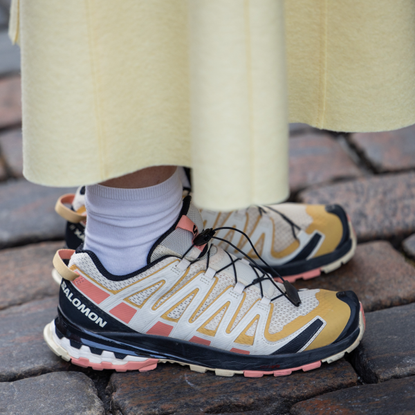 COPENHAGEN, DENMARK - JANUARY 29: A guest wears Salomon sneakers outside Nicklas Skovgaard during the Copenhagen Fashion Week AW24 on January 29, 2024 in Copenhagen, Denmark. (Photo by Christian Vierig/Getty Images)