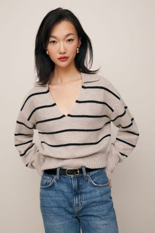 reformation winter sale woman wearing striped jumper with collar detail