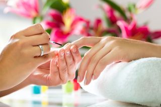 A woman gets a manicure