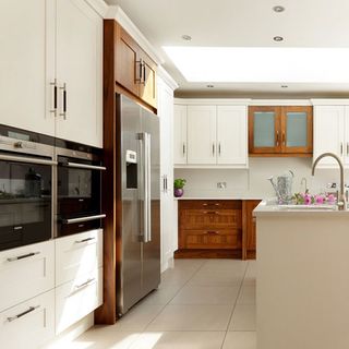 kitchen with cream wall and fridge
